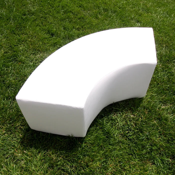 Single white Arc curved bench module on grass