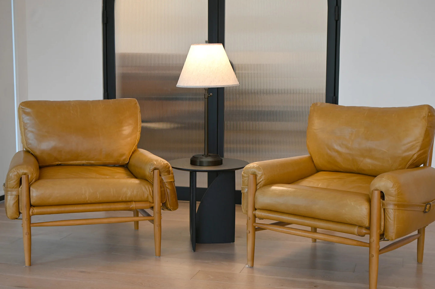 Stylish cordless table lamp with black metal base and beige empire shade