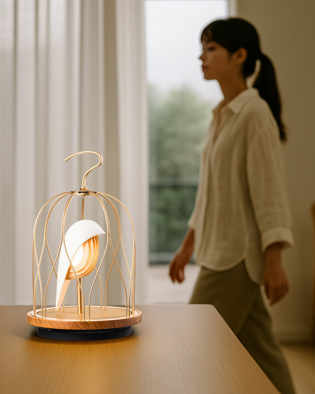 Daqiconcept Jingoo Ivory White lit on a dining table by a window