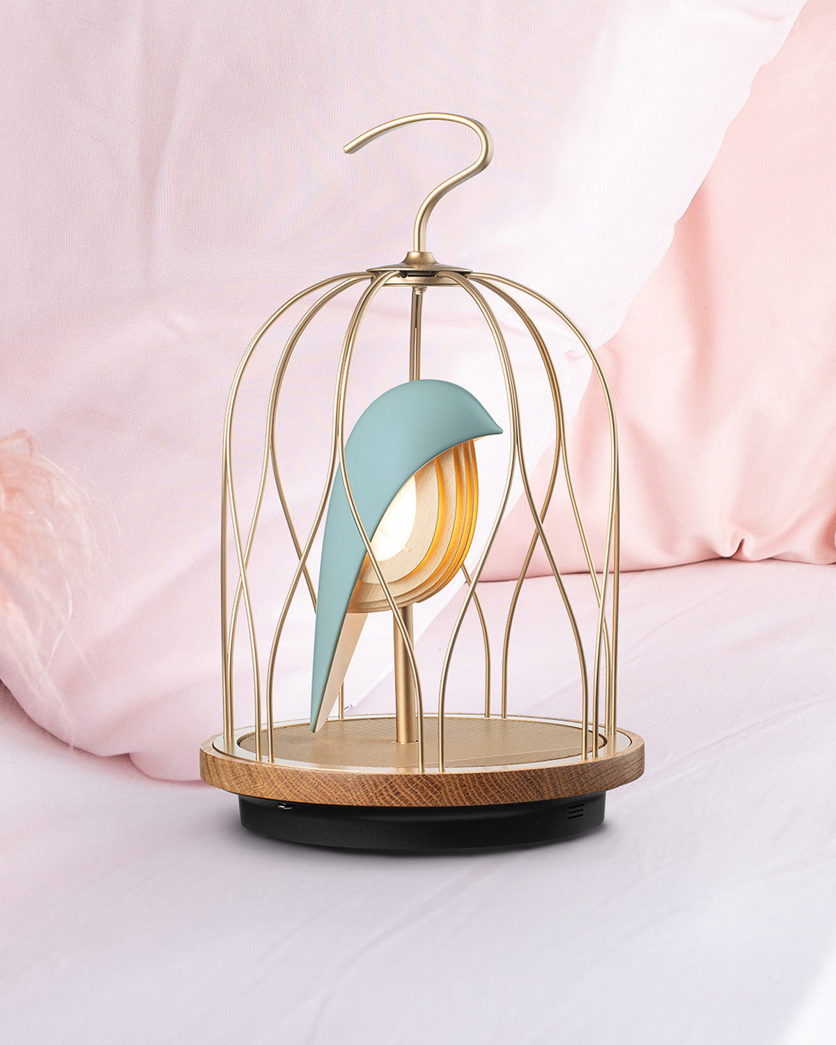 Daqiconcept Jingoo Aqua Blue speaker lamp on soft pink bedding