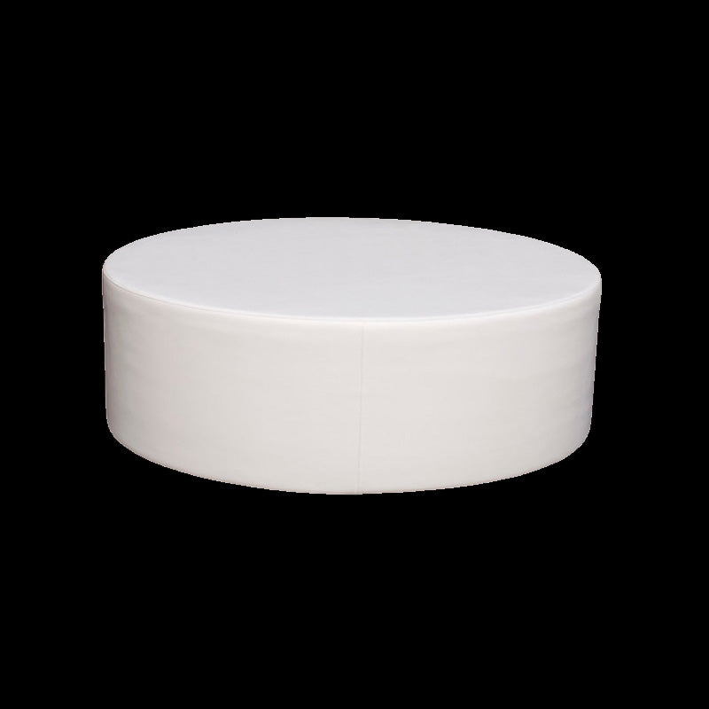Studio view of a white La Fête Note oval ottoman on a black background