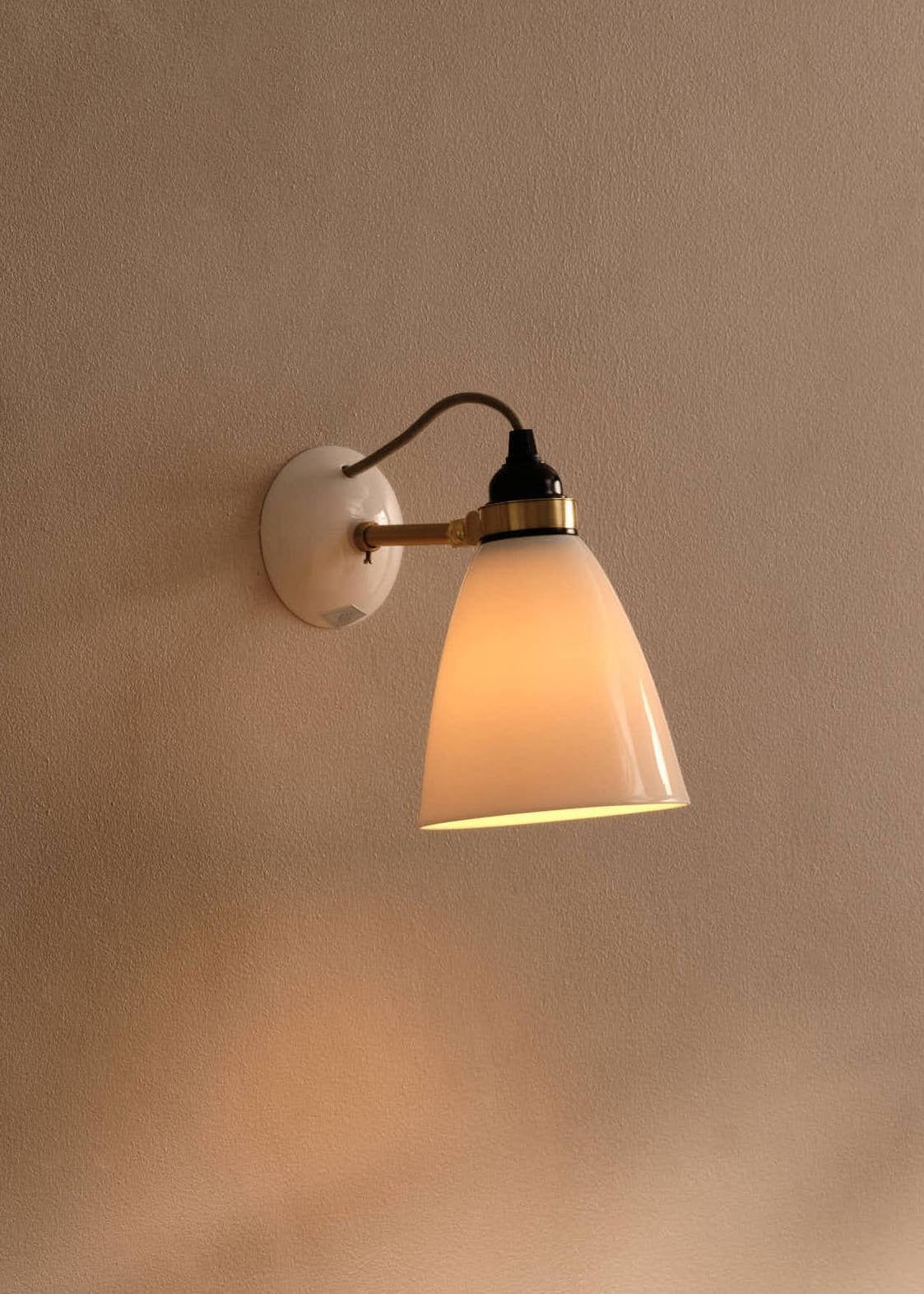 Hector 30 Medium Dome Wall Light (with satin brass arm) in an interior from the Original BTC Autumn/Winter 2026 lookbook