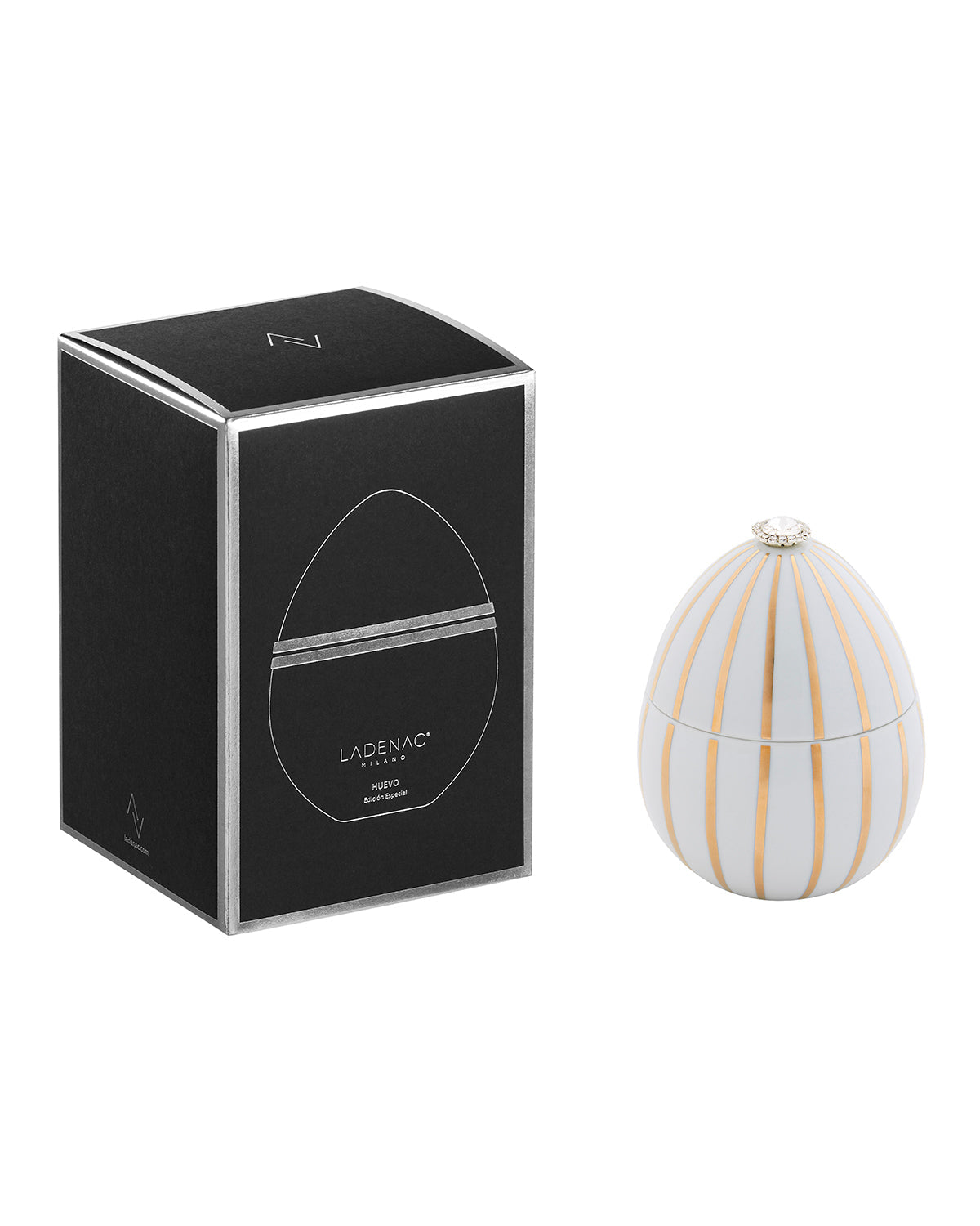 Bois de Russie 220 g ceramic egg candle by Ladenac Milano, White Gold Stripes egg beside its black gift box