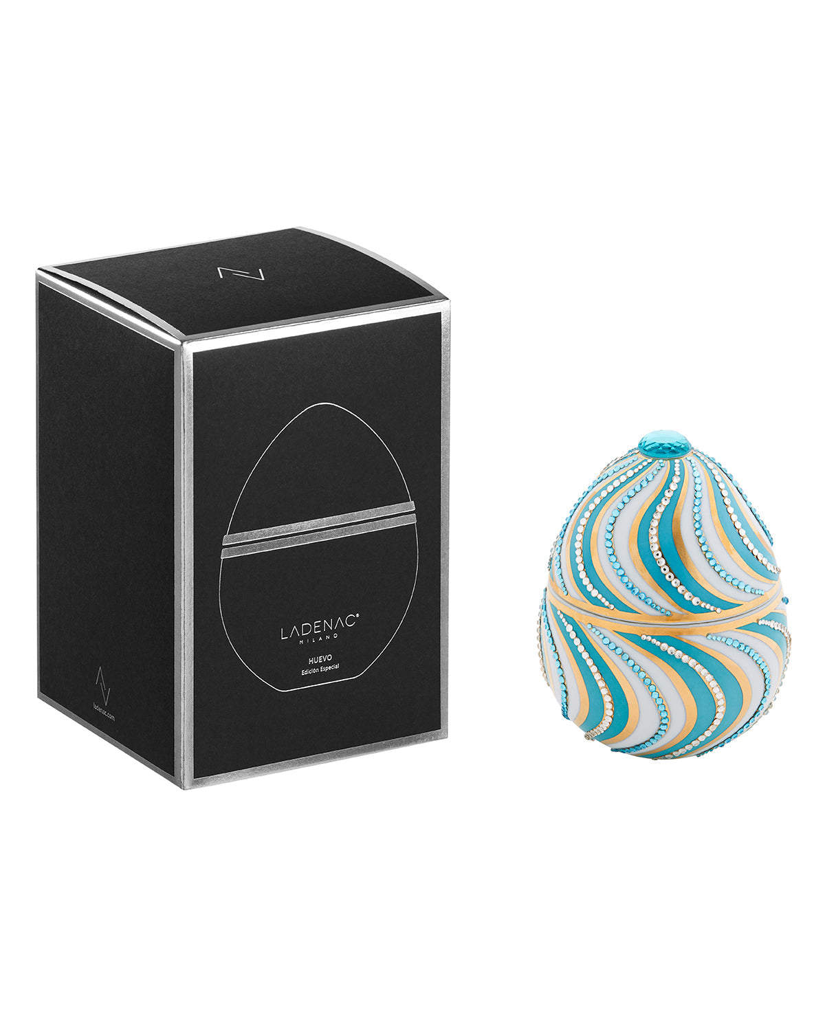 Bois de Russie 220 g ceramic egg candle by Ladenac Milano, Espiral Blue egg beside its black gift box