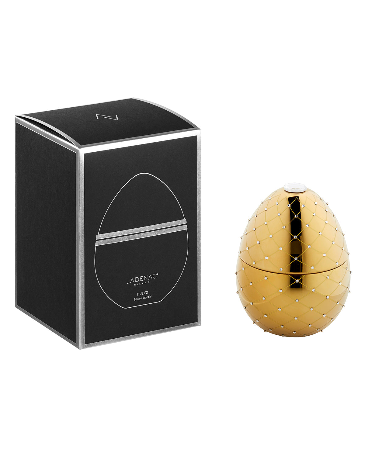 Bois de Russie 450 g ceramic egg candle by Ladenac Milano, Gold and Crystals egg beside its black gift box