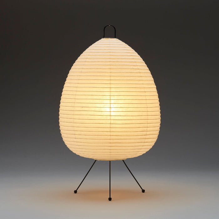 Asano Donguri Lamp A120 glowing warmly in dark setting