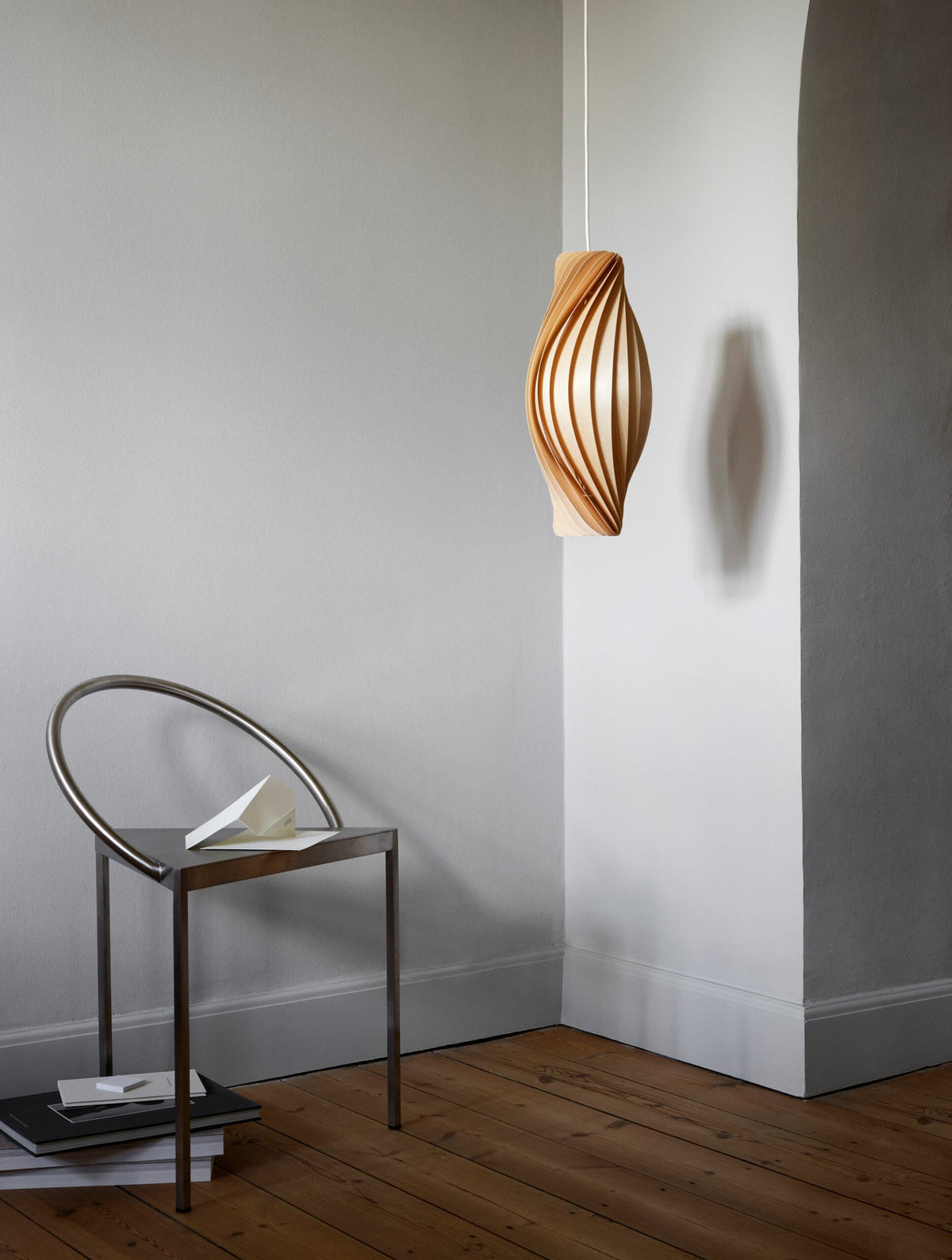 Tom Rossau No.111 pendant light – near a white wall, unlit