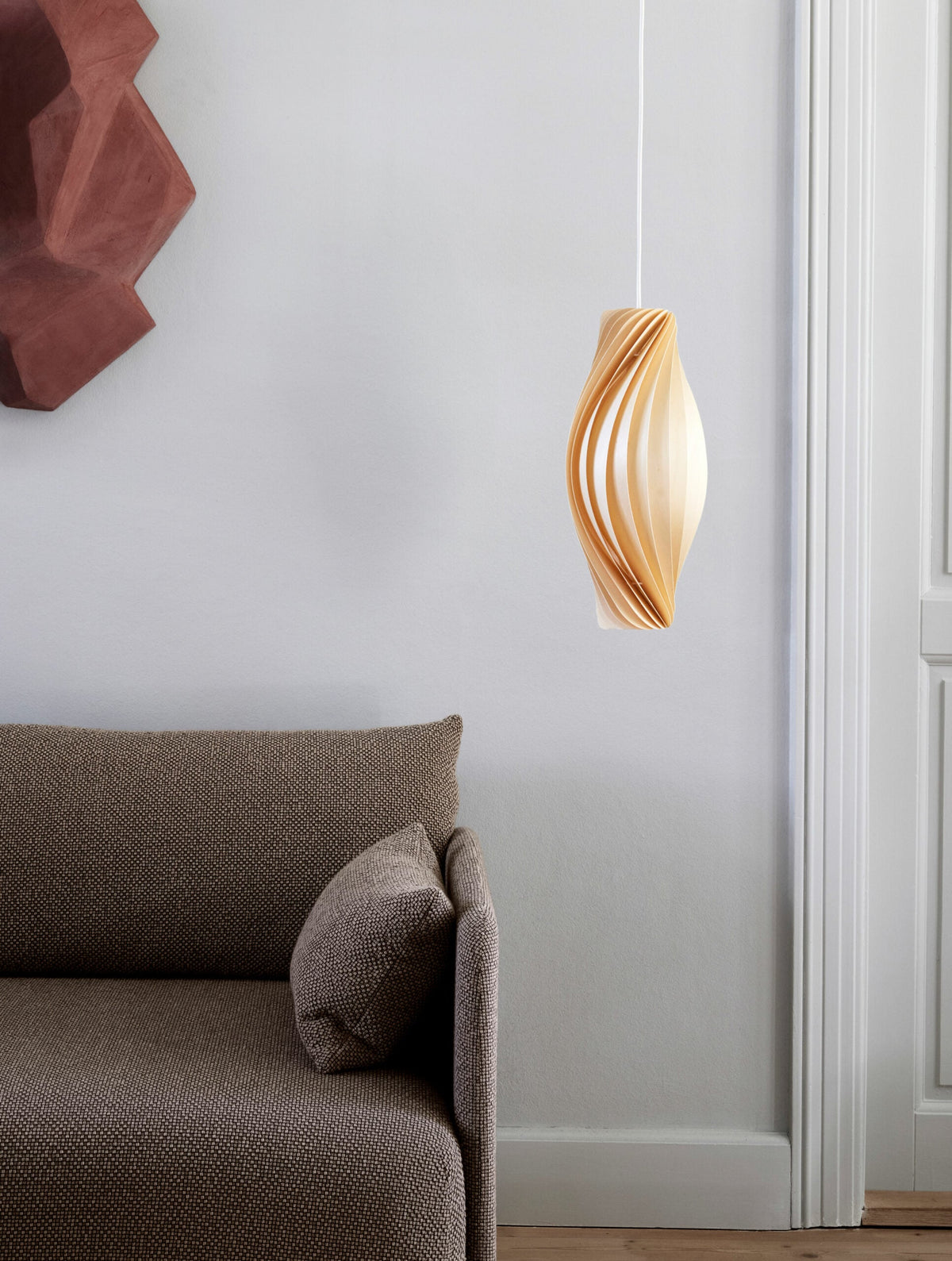Tom Rossau No.111 pendant light – beside an armchair