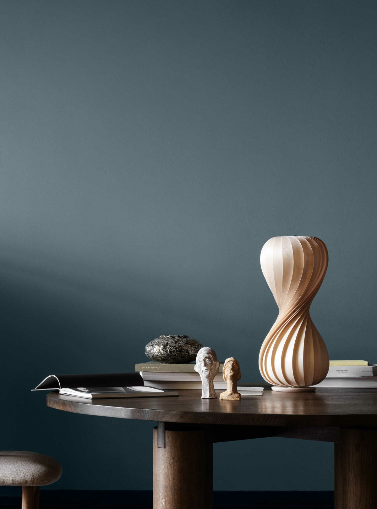 Tom Rossau TR7 table lamp – lit on a sideboard