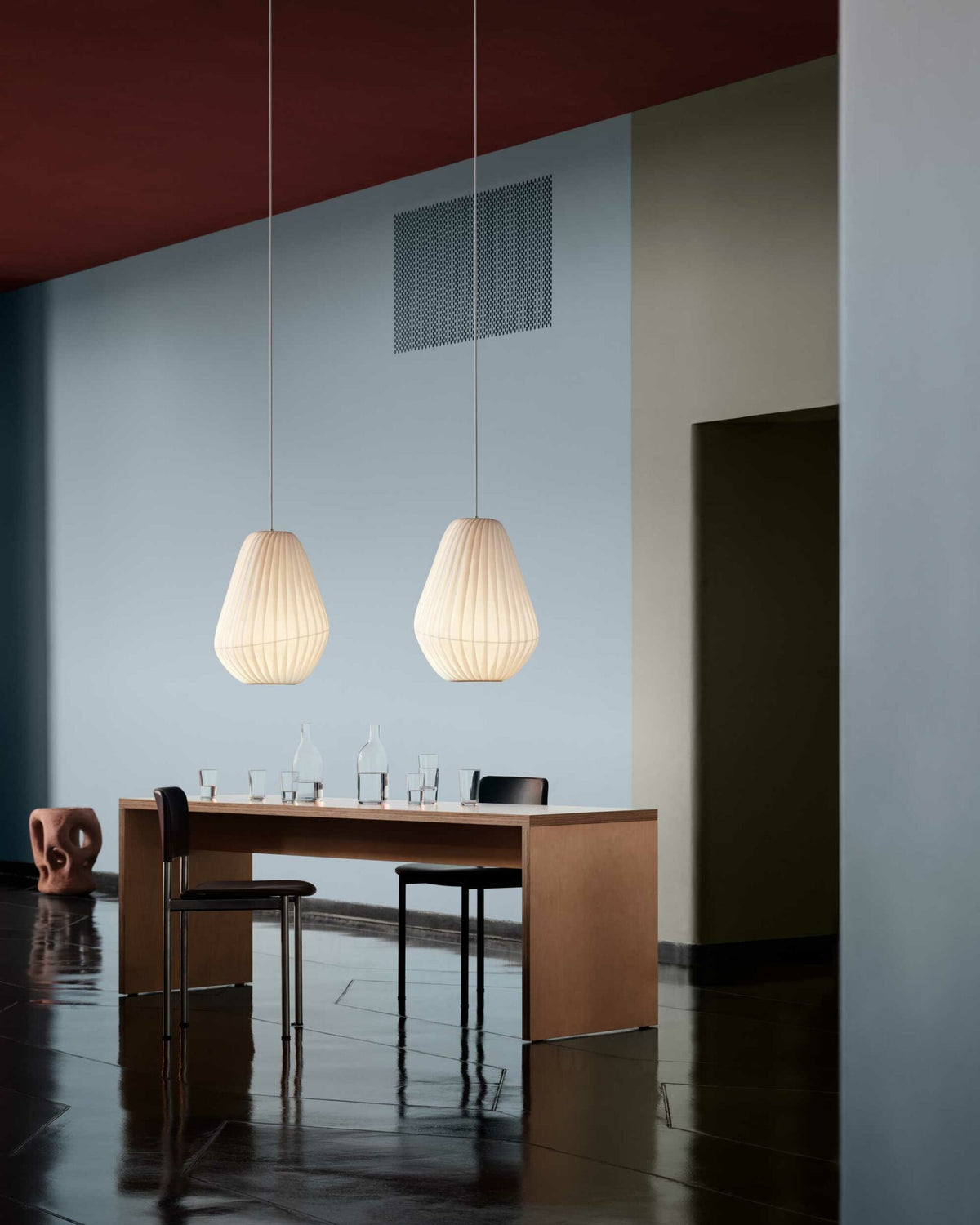 Tom Rossau TR31 pendant light – lit over a dining table