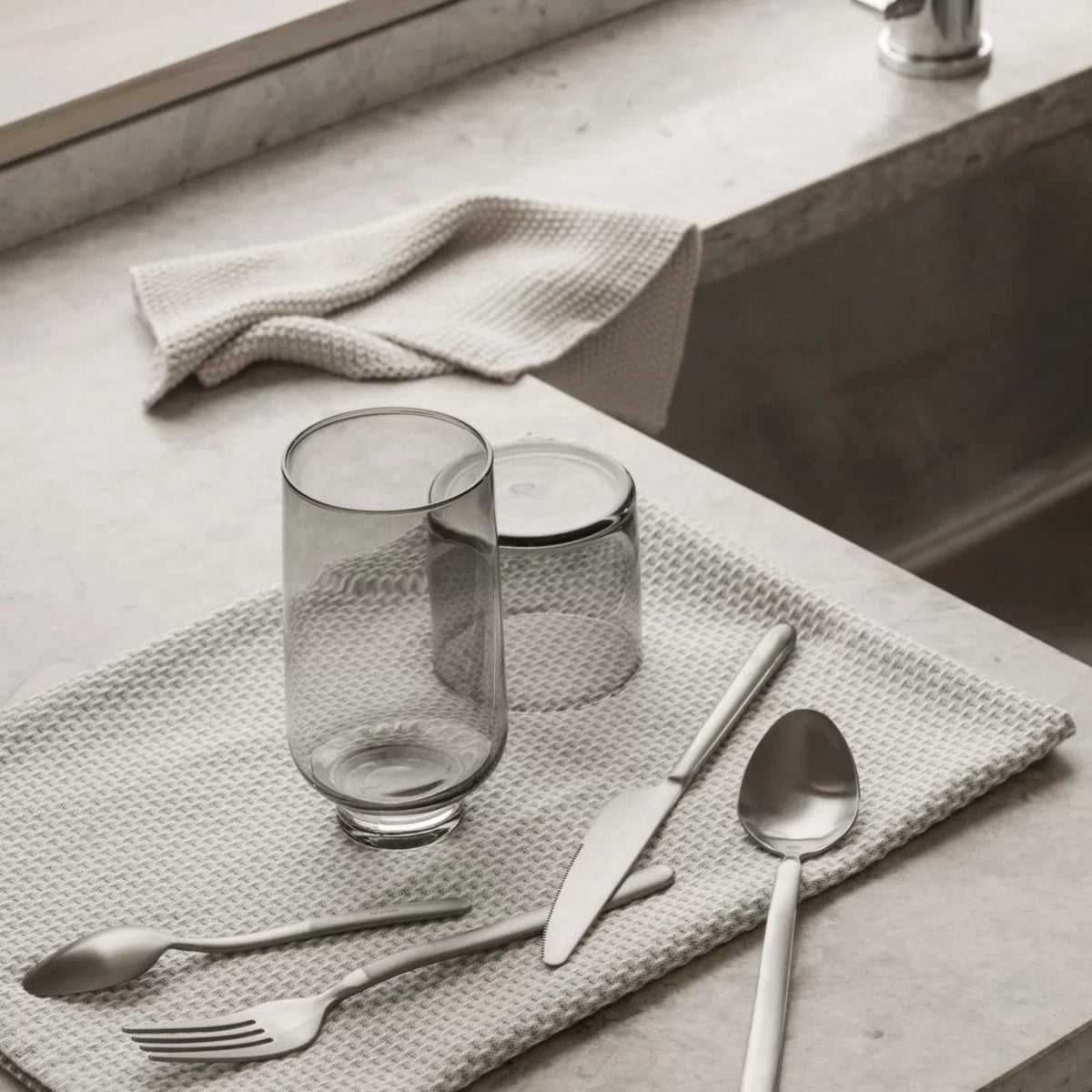 blomus MERA Hand-Blown Smoke Glasses, Set of 2, Low or Tall – MERA smoke glasses in a styled setting (1)