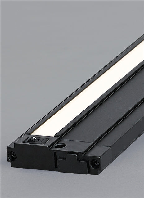 Visual Comfort Unilume LED Slimline under-cabinet lights in a kitchen, lighting the counter below white cabinets