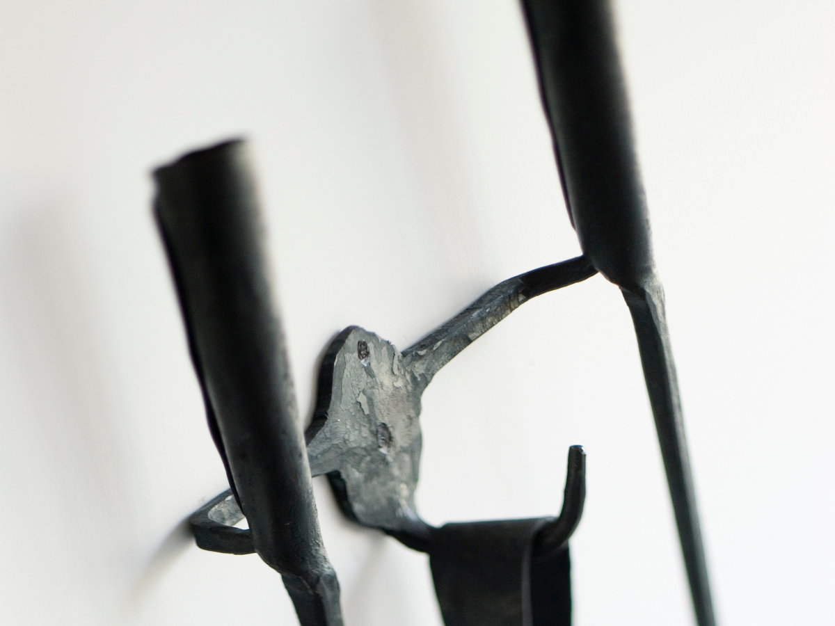 Ferro & Fuoco Wall-Mount Bar by Conmoto – close-up of the forged bar holding a tool (tools sold separately)