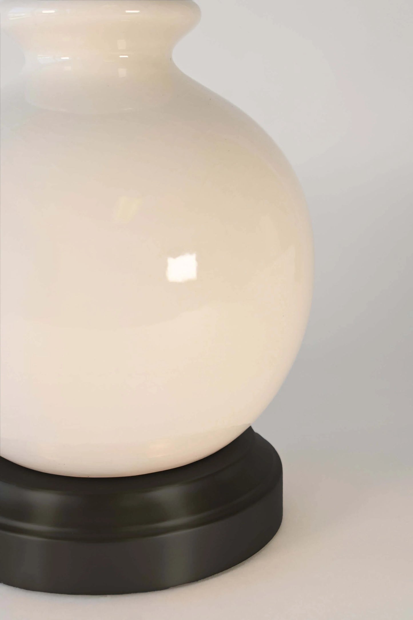Ivory ceramic accent lamp with cordless functionality and warm ambient lighting