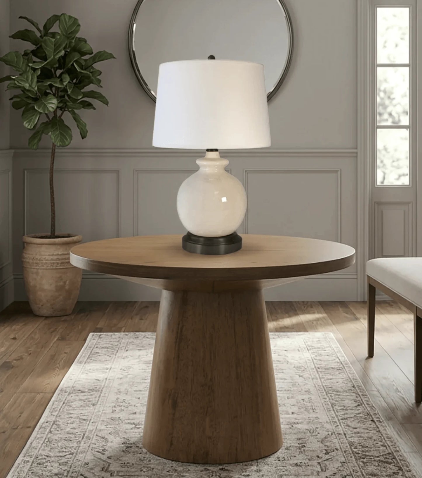 Battery-operated ceramic table lamp with neutral finish and timeless styling