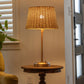 Rattan shade detail of the Alexis Cordless Table Lamp by Modern Lantern