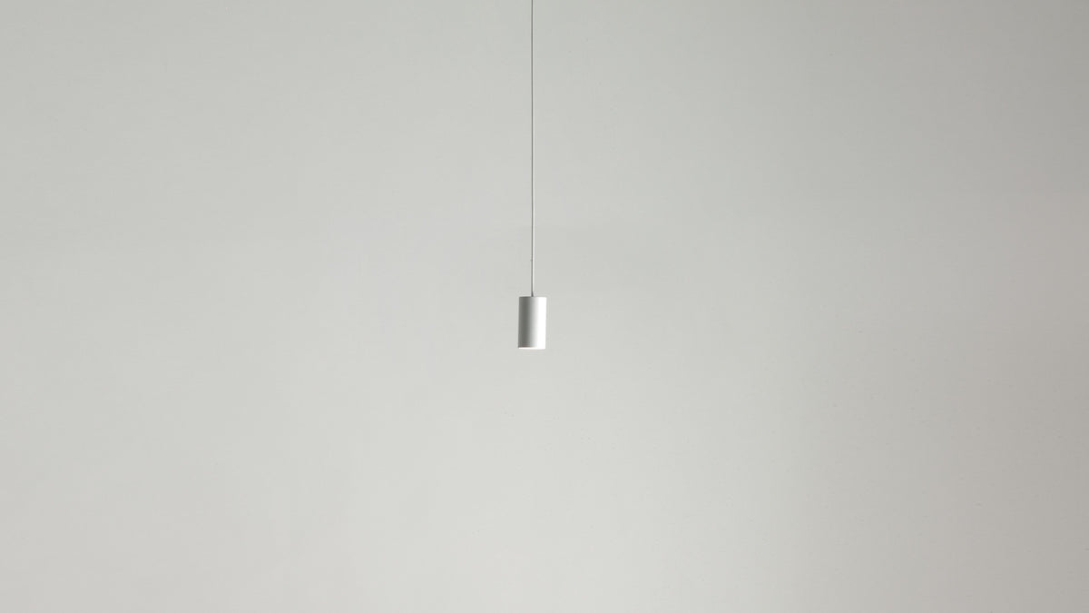 White Anvil Spot S spot pendant hanging against a pale wall