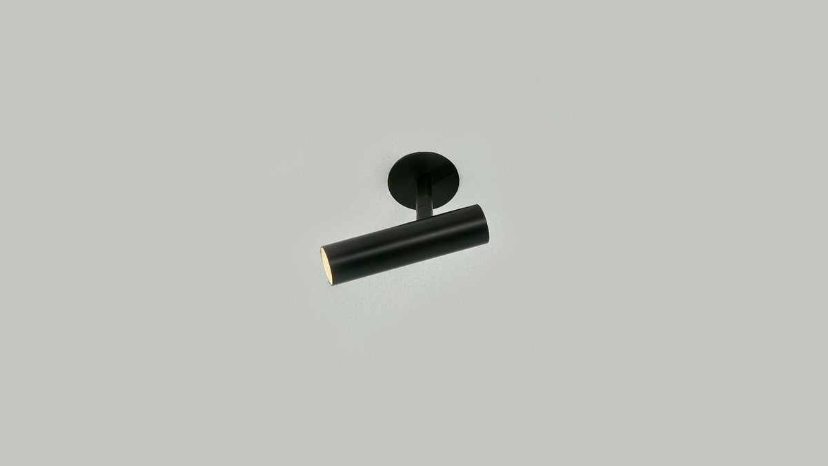 Black Anvil Slim Spot recessed spotlight on a grey ceiling