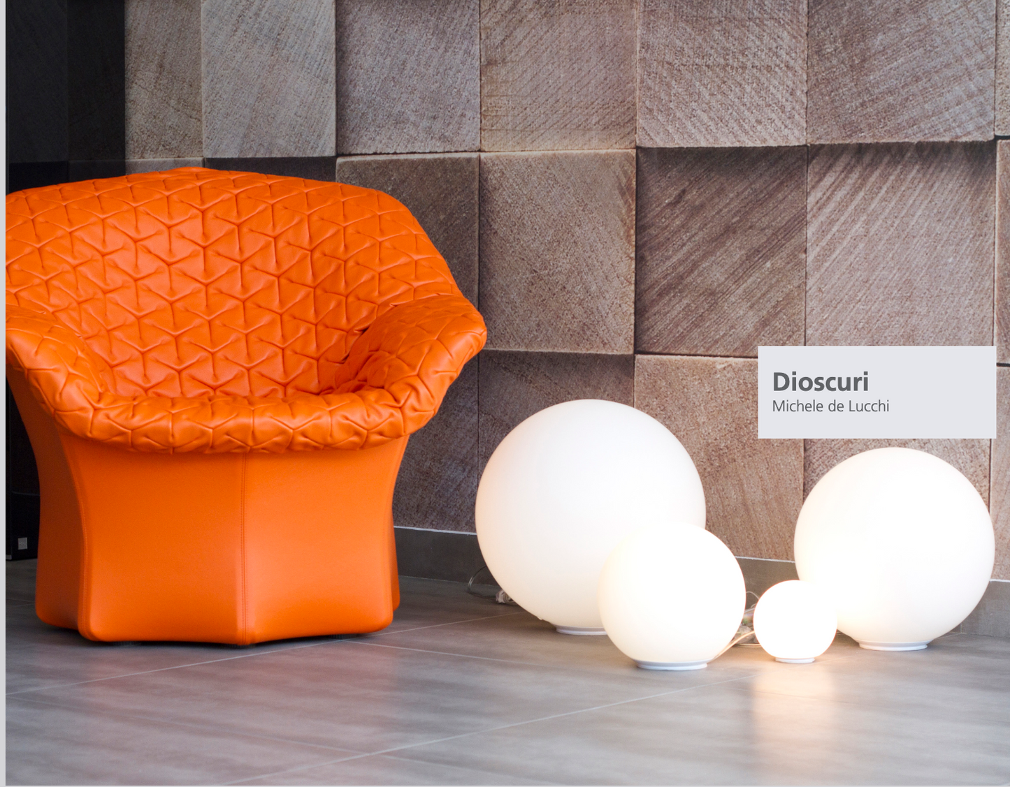 Artemide Dioscuri  white glass globe table lamp in outdoor setting