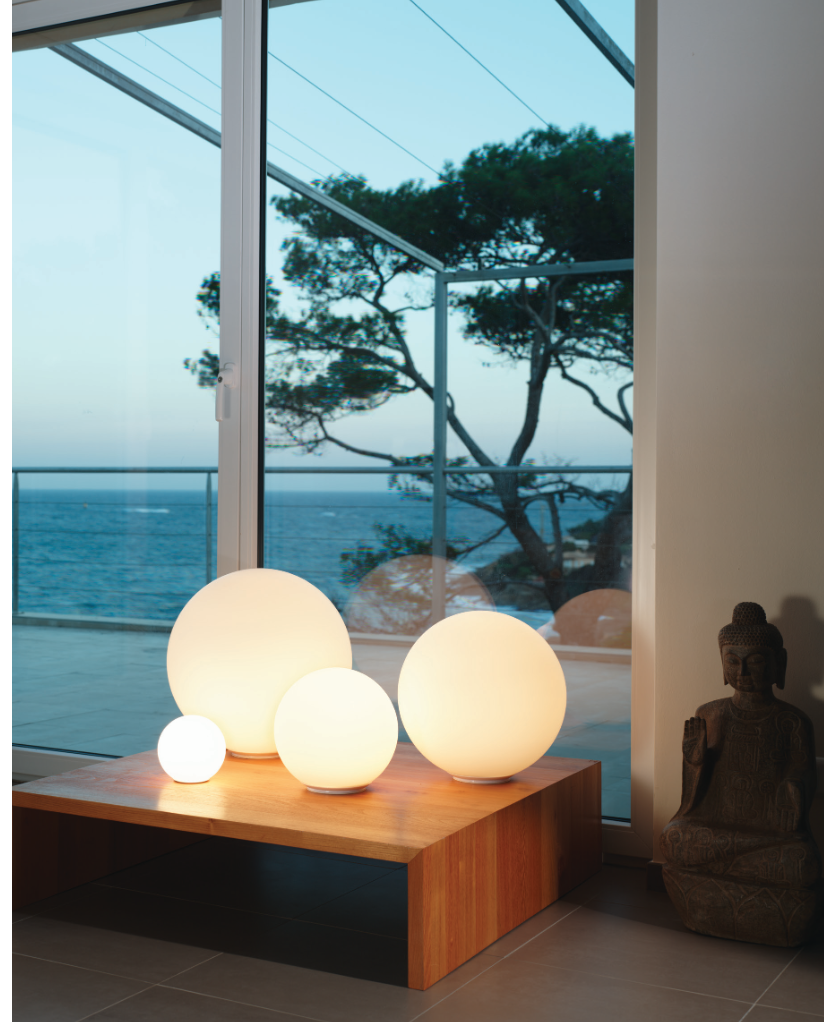Artemide Dioscuri glass table lamp on modern side table