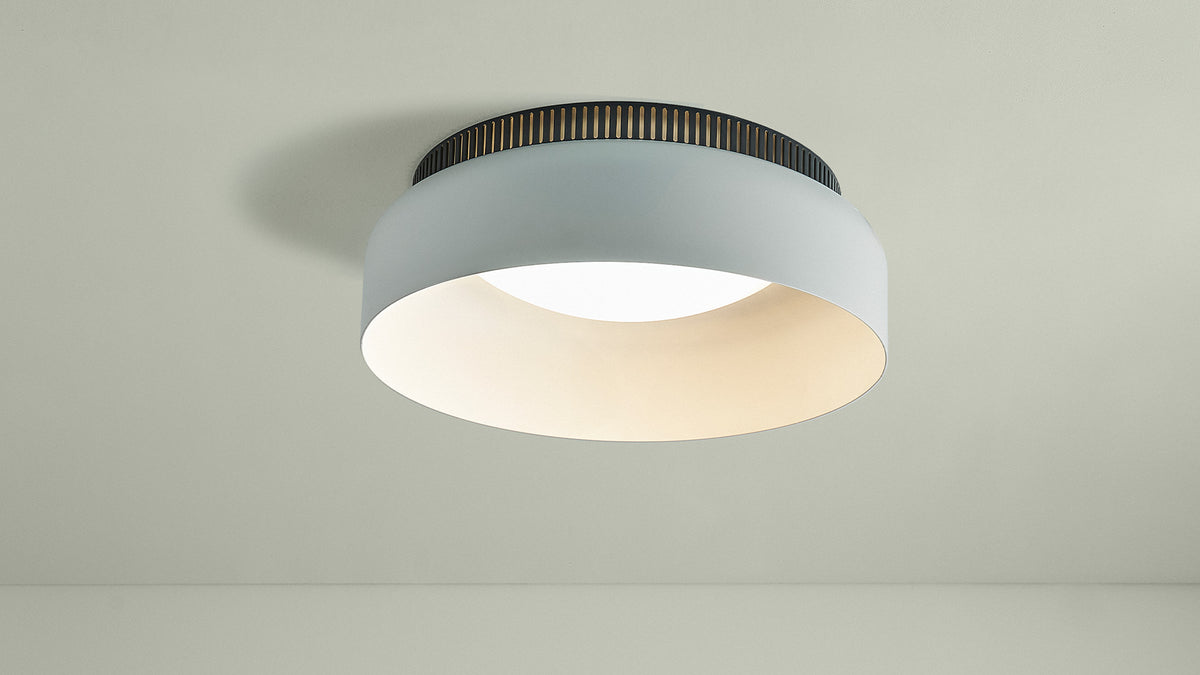 Wide white Aspen C ceiling lamp against a sage green wall