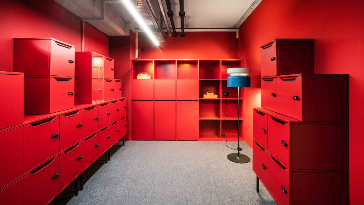 B.lux Aspen floor lamp with a teal shade in a red storage room