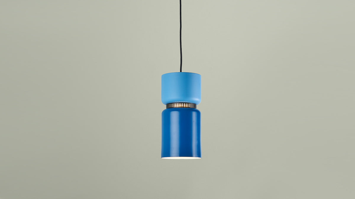 B.lux Aspen pendant with a blue shade against a sage wall