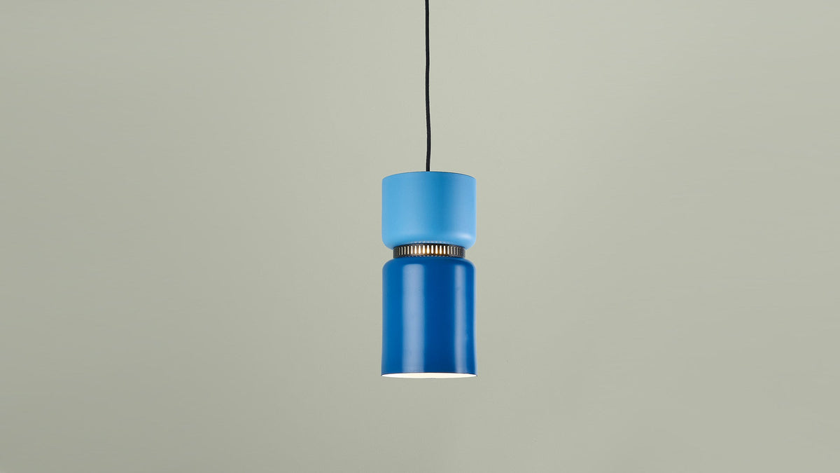 B.lux Aspen pendant with a blue shade against a sage wall