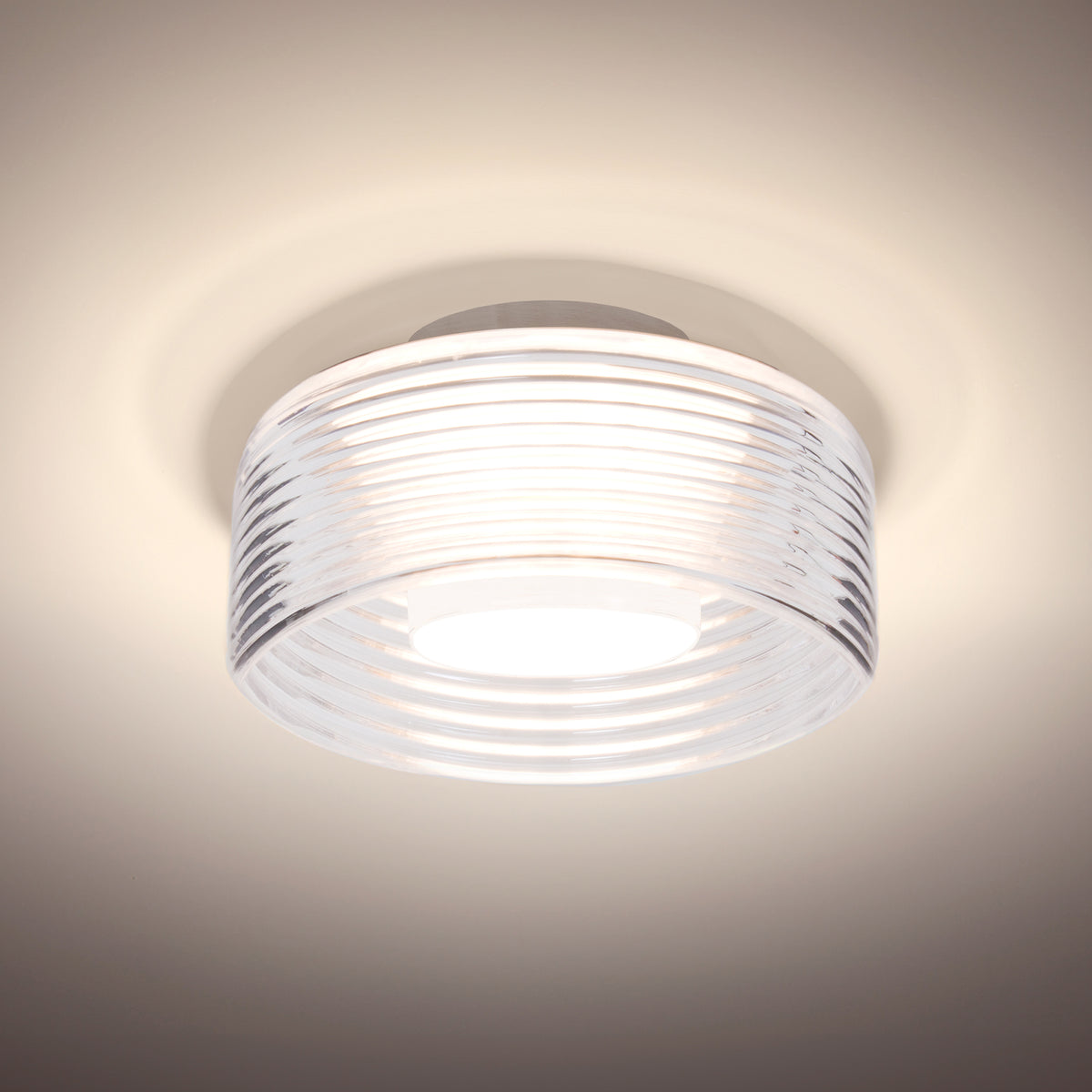 Besa Belu LED semi-flush ceiling light, Clear ribbed drum glass, satin nickel canopy – studio view