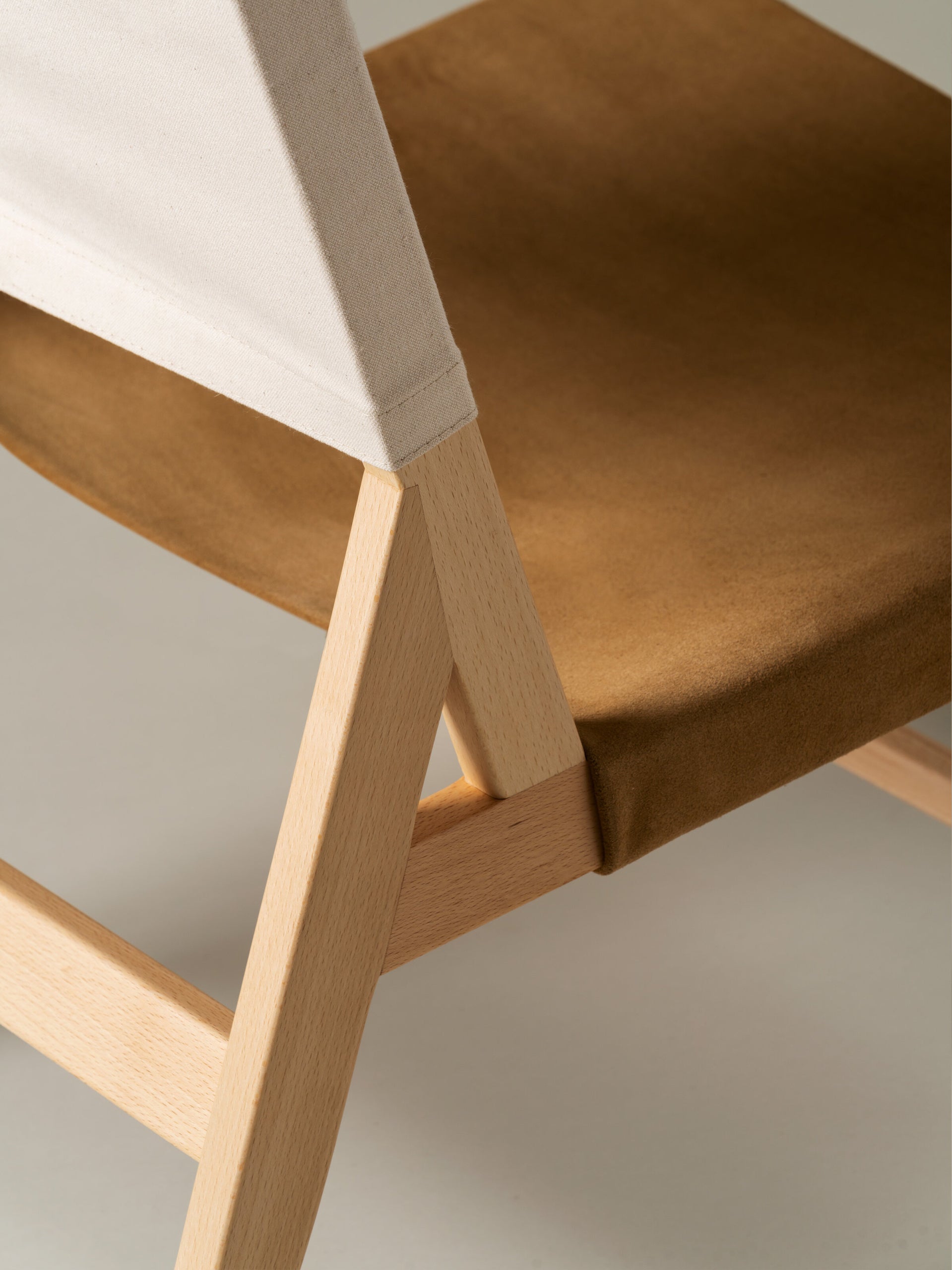 Spanish modern armless chair with leather upholstery