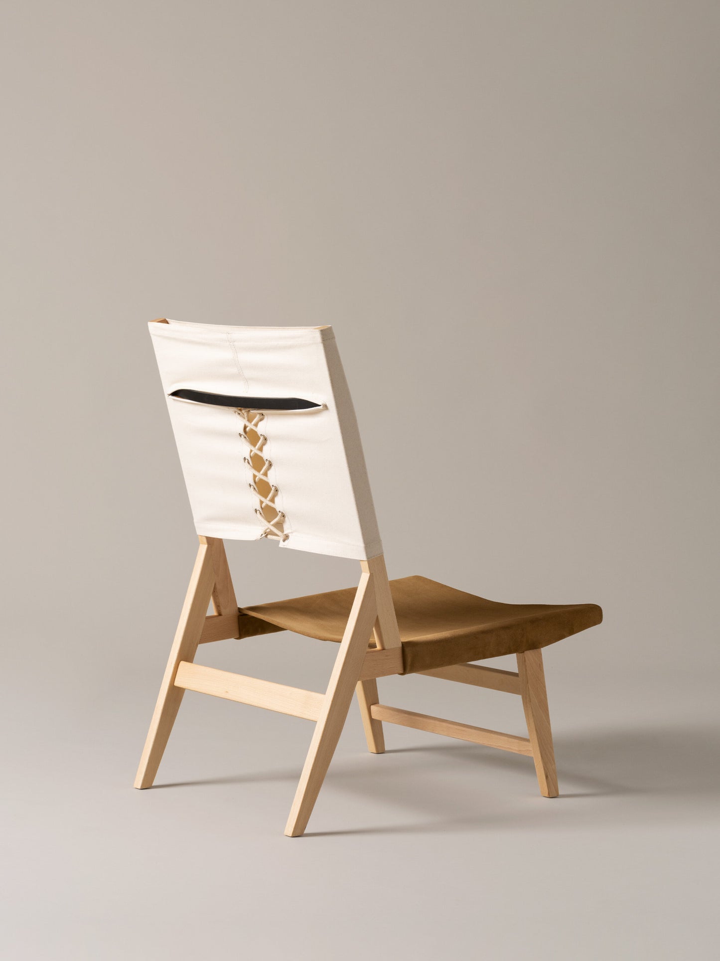 Low lounge chair for living room and hotel interiors