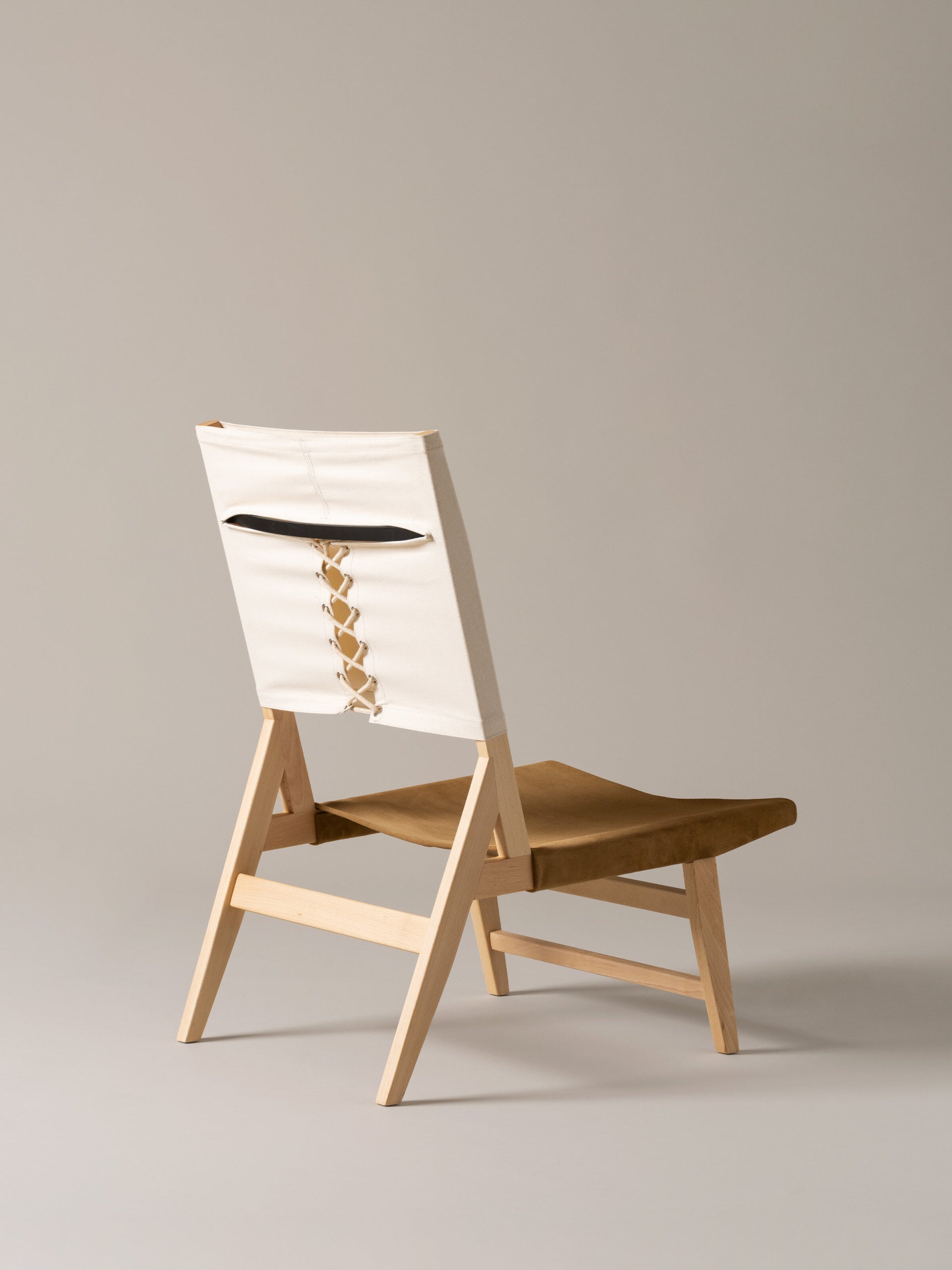 Low lounge chair for living room and hotel interiors