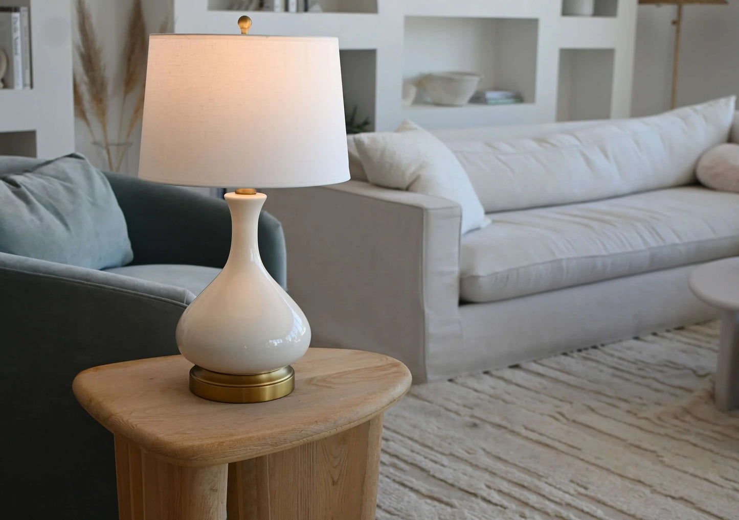 Rechargeable Bartlett lamp with off-white linen shade and warm glow