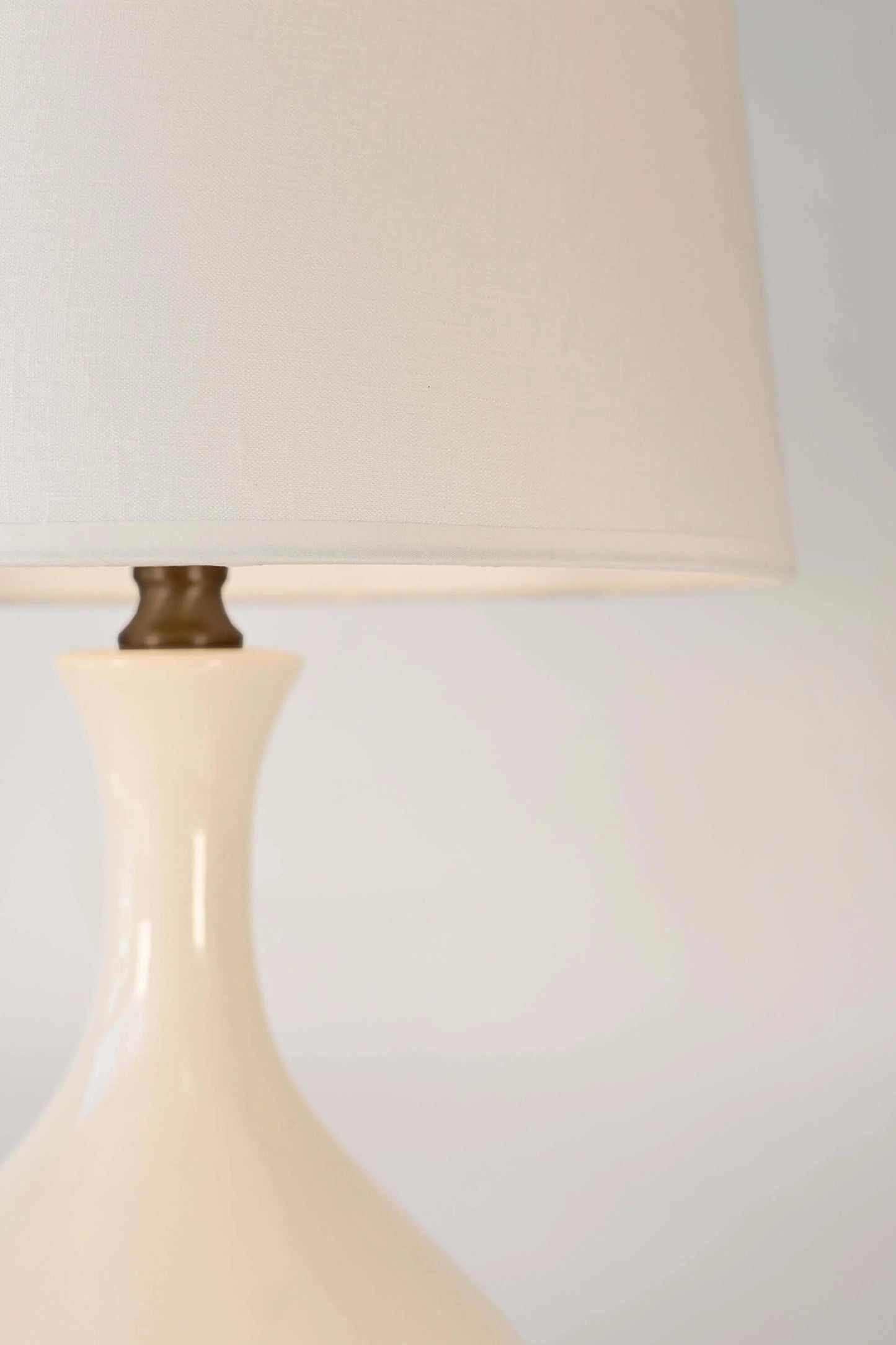 Rechargeable Bartlett table lamp in ivory ceramic and antique dark brass