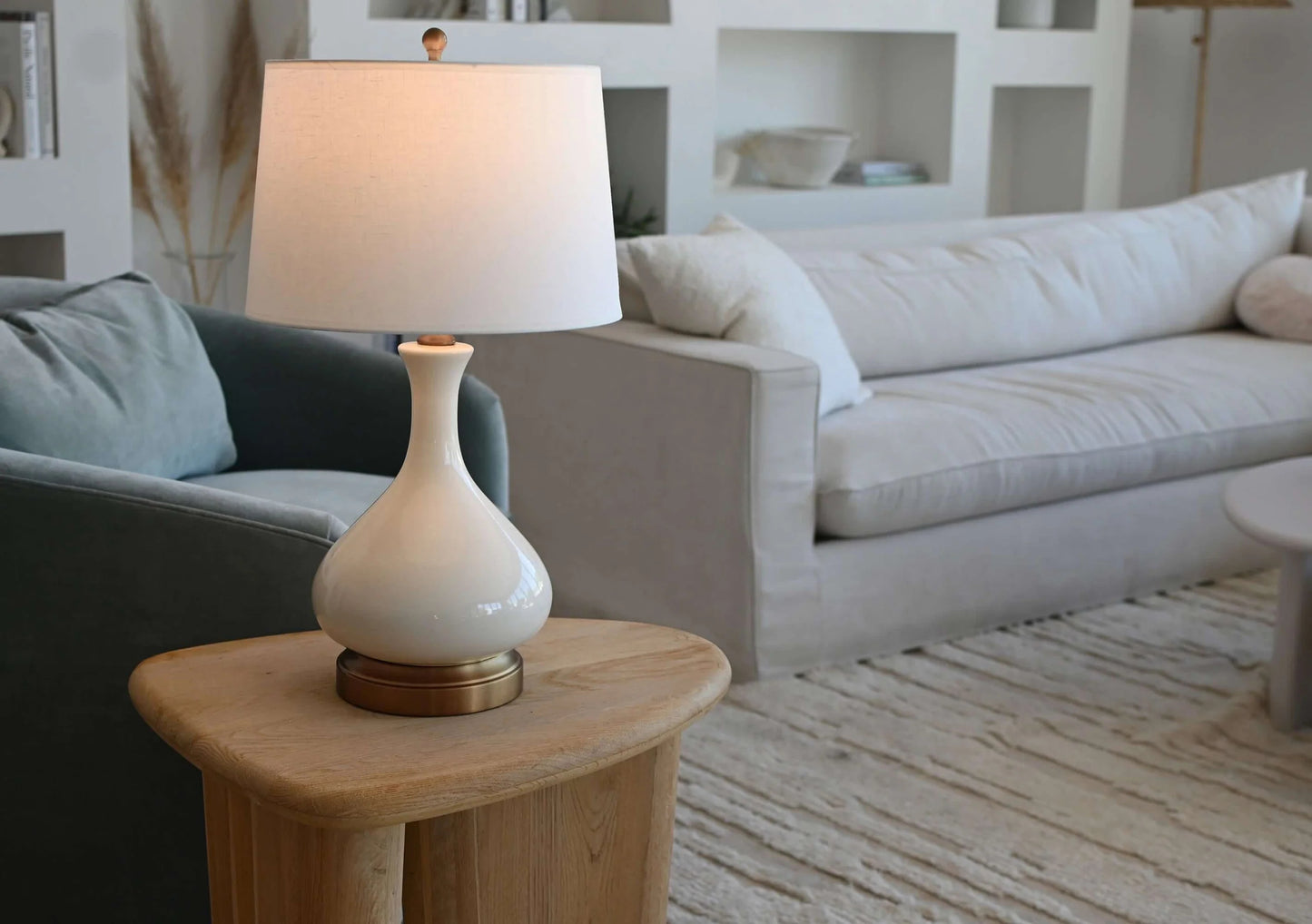 Elegant cordless table lamp featuring ivory crackle ceramic and brass details