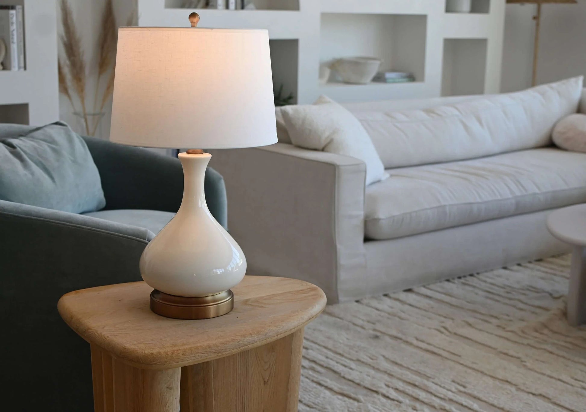 Elegant cordless table lamp featuring ivory crackle ceramic and brass details