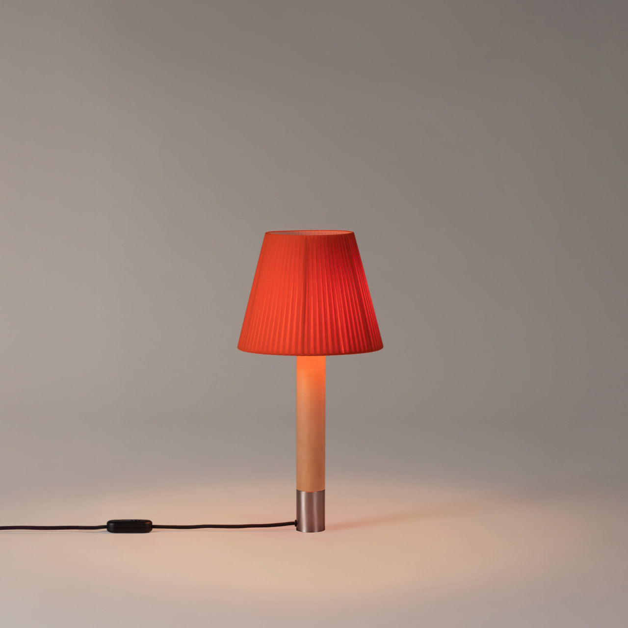 Designer Basica M1 table lamp from Barcelona, Spain with refined minimalist craftsmanship, red-amber ribbon shade
