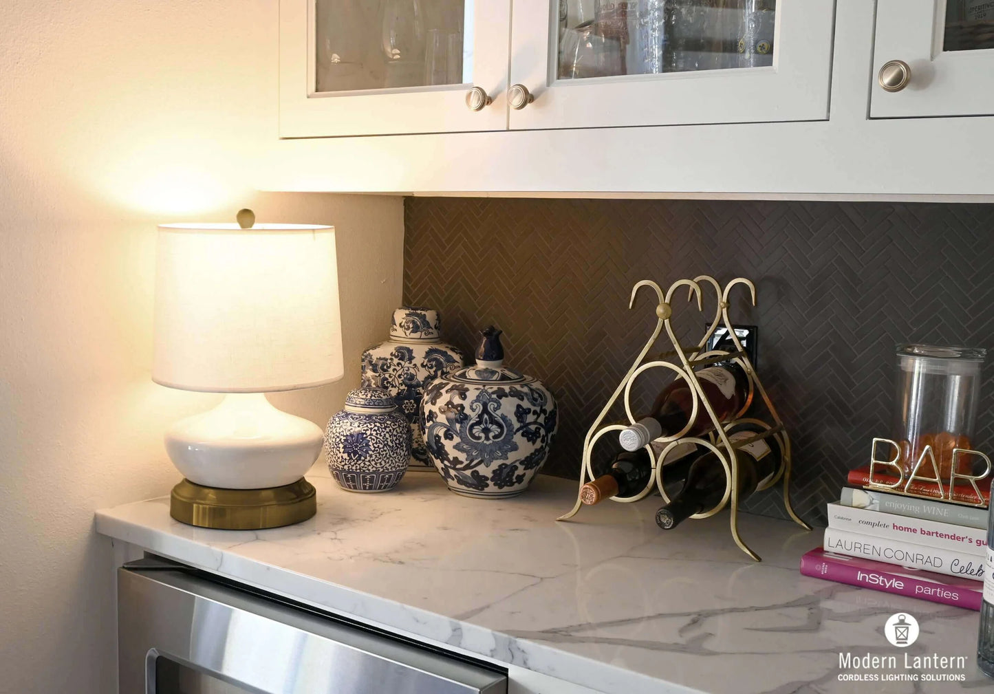 Bella rechargeable table lamp with ivory ceramic base for hotel interiors