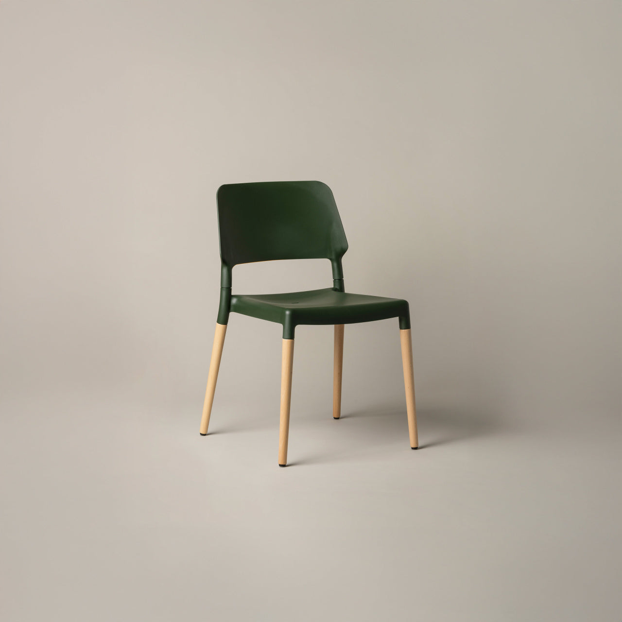 Green Belloch indoor chair with natural beech wood legs for hotels cafés workspaces and contemporary interiors