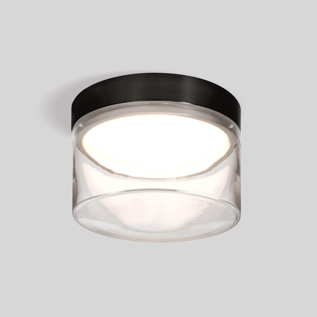 Energy efficient LED flush mount with warm 3000K illumination with clear glass and black finish
