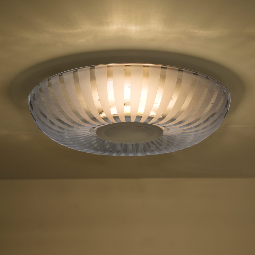 Decorative smoke blown glass shade with frosted stripe detailing for flush mount lighting