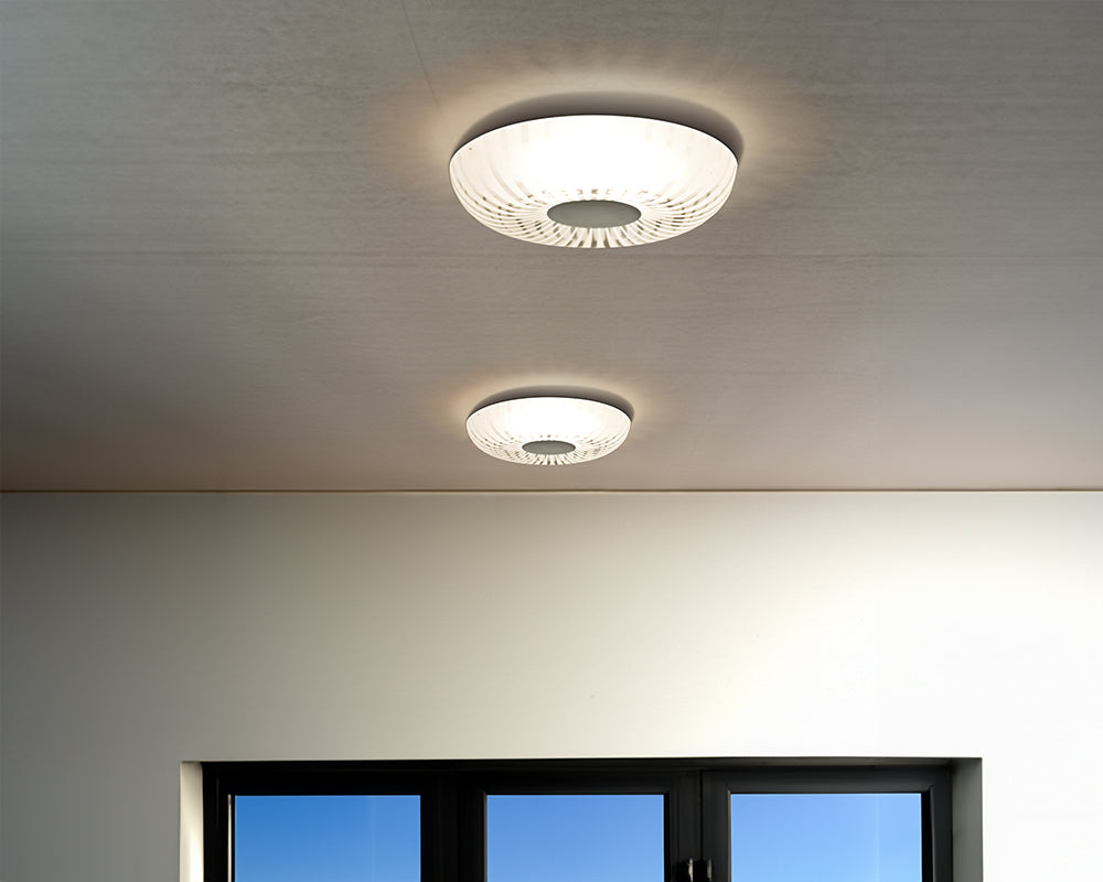 Contemporary ceiling fixture installed in a modern bedroom interior