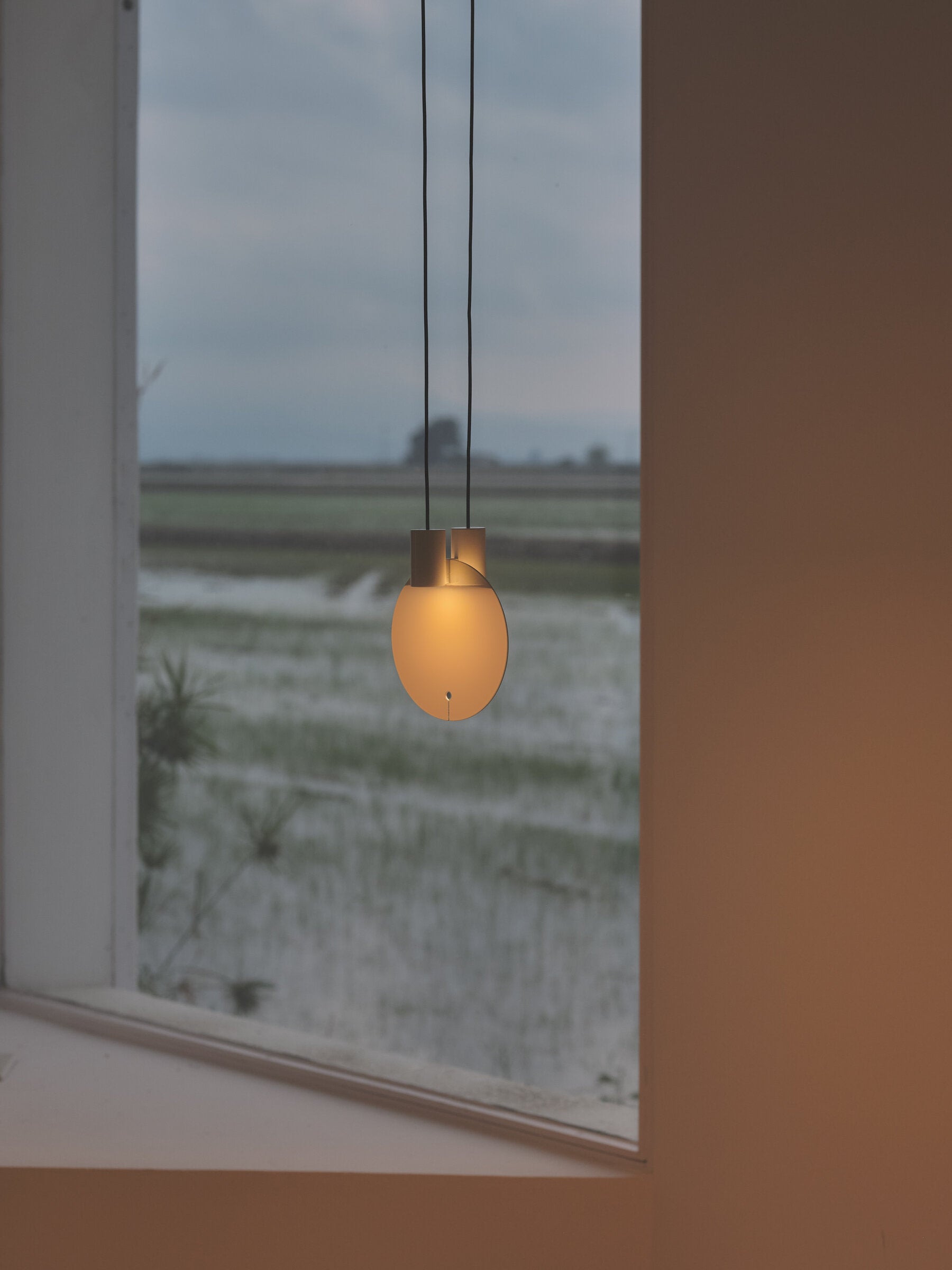 High-end glossy creme white pendant lamp for modern dining spaces