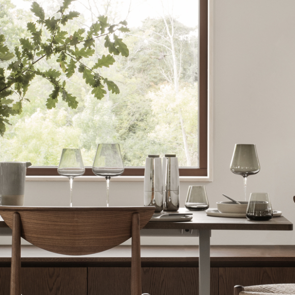 blomus BELO Tumblers 9.5 oz, Set of 4, Mouth-Blown – tinted tumblers on a dining table by the window