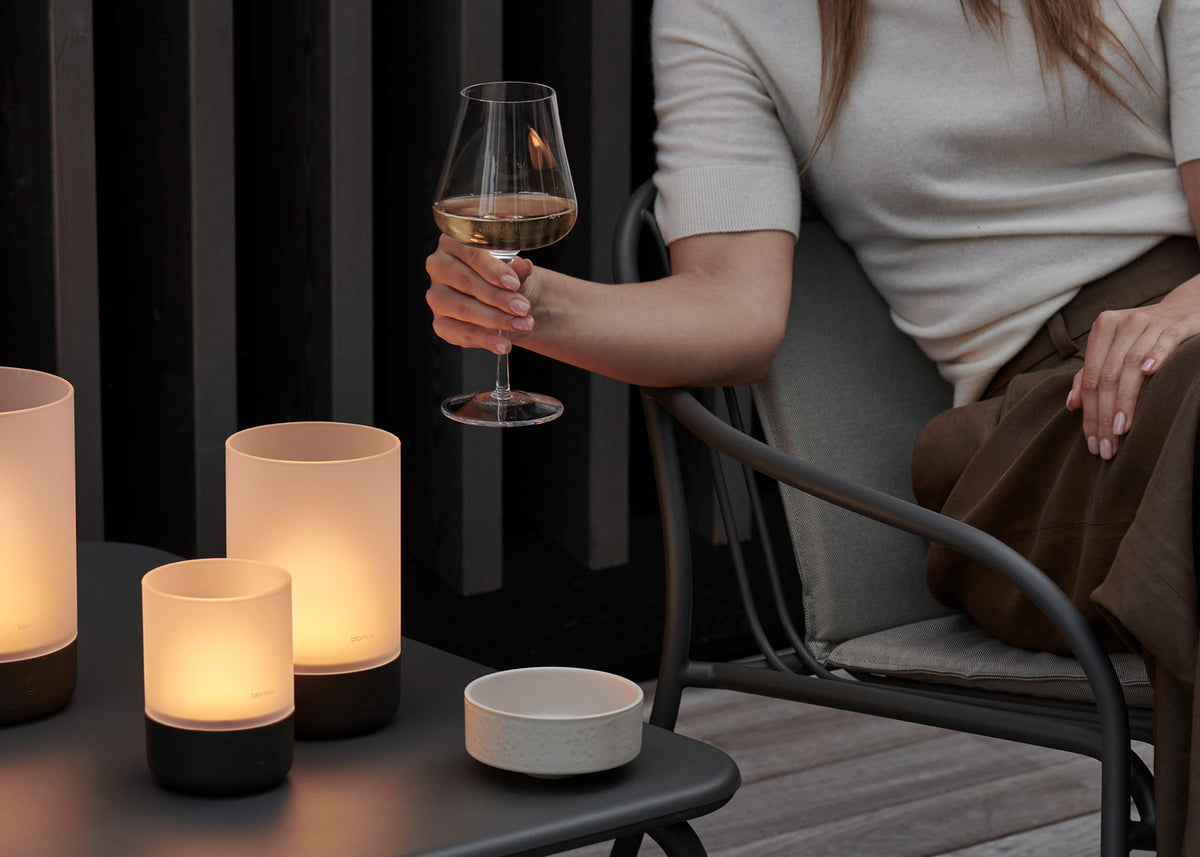 blomus BELO White Wine Glasses 13.5 oz, Set of 2 – clear white wine glass in hand on a terrace at dusk