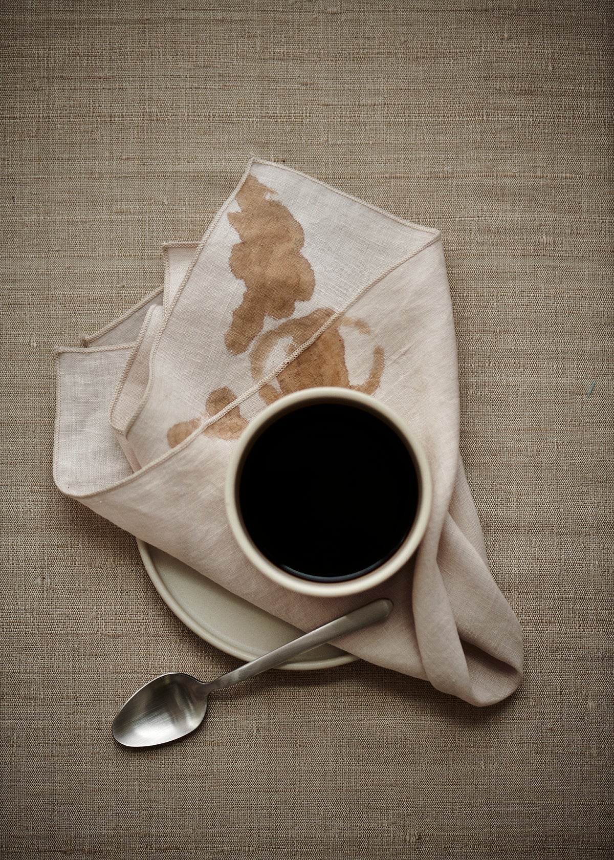 blomus MAKOTO Handleless Stoneware Cups – Moonbeam tea cup of coffee on a side plate
