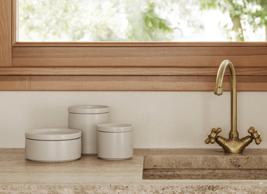 blomus PILAR Stoneware Canisters with Airtight Lid – three Moonbeam canisters on a kitchen windowsill
