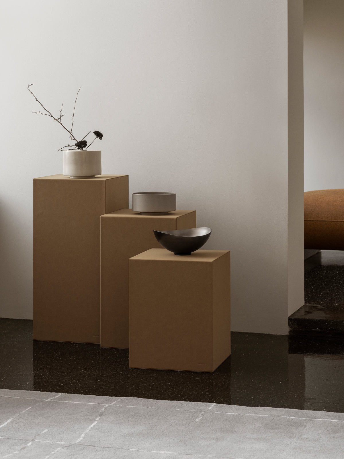 blomus MAKOTO Stoneware Vase, Narrow Opening – Moonbeam vase styled on a pedestal