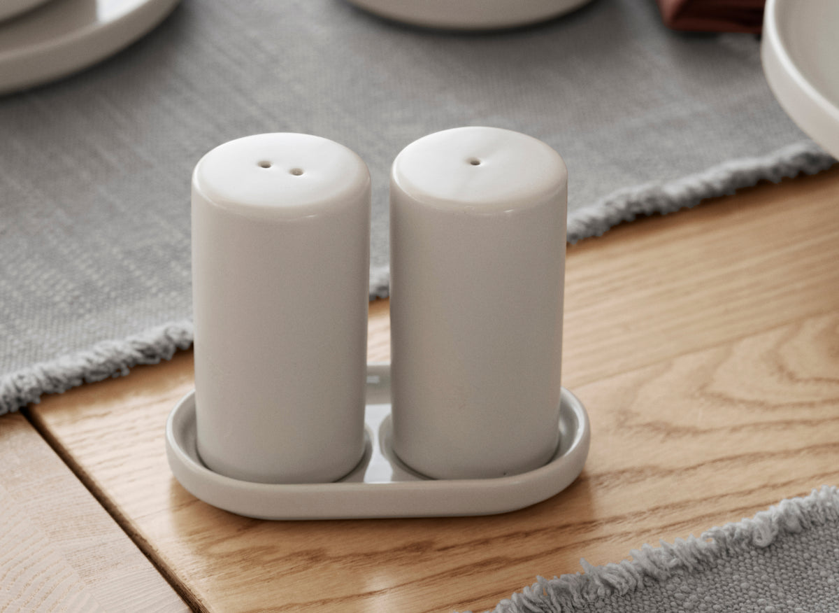 blomus PILAR Salt & Pepper Shakers with Tray – Moonbeam salt and pepper shakers on their tray, close up