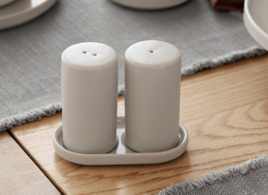 blomus PILAR Salt & Pepper Shakers with Tray – Moonbeam salt and pepper shakers on their tray, close up
